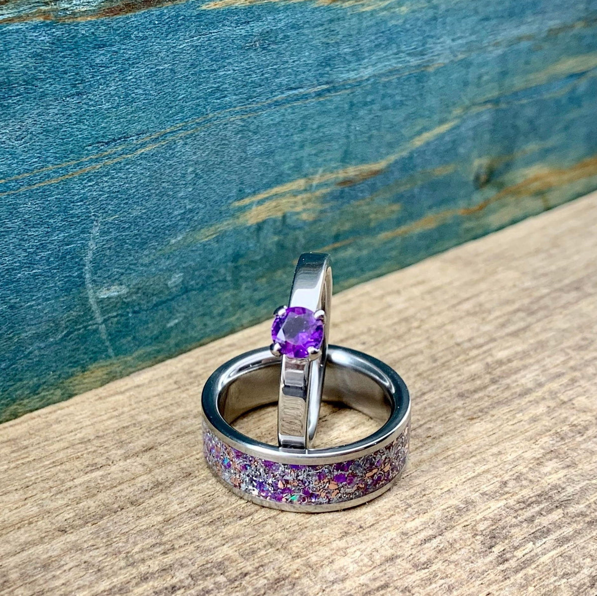 RobandLean's amethyst wedding band set featuring his and hers meteorite engagement rings with purple gemstones and sleek metal bands.