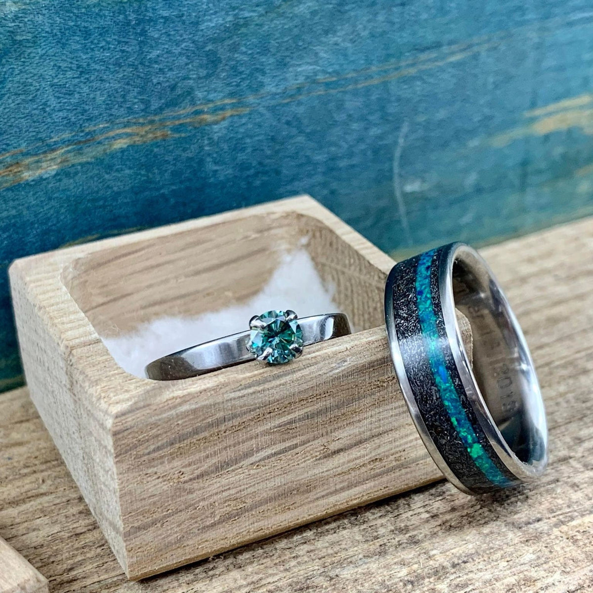 His and hers meteorite wedding bands with moissanite engagement ring, crafted by RobandLeans Rings, featuring sleek, modern design.