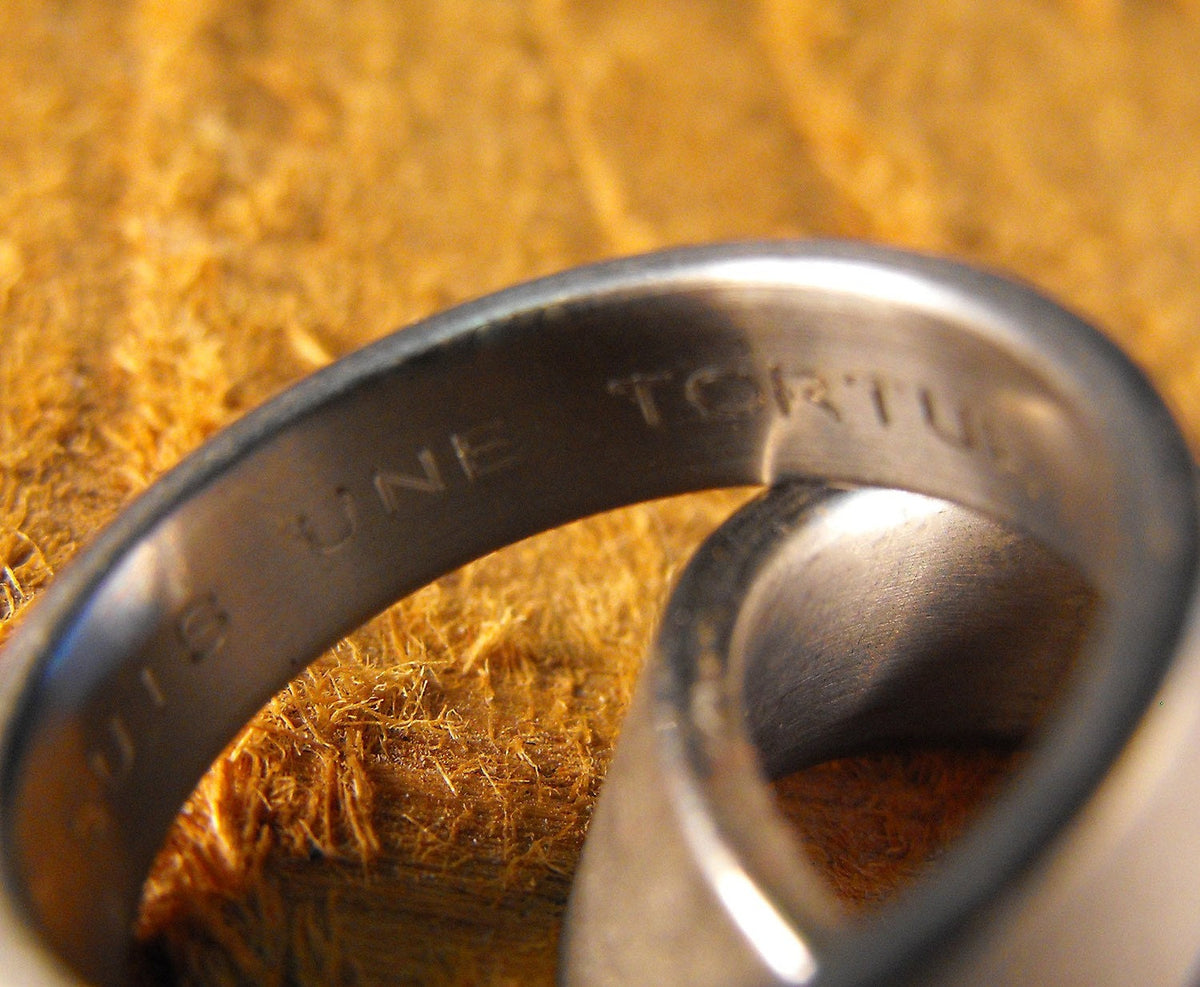 His and hers titanium wedding bands set by RobandLean's with custom engraving, featuring sleek, matching wedding ring designs.