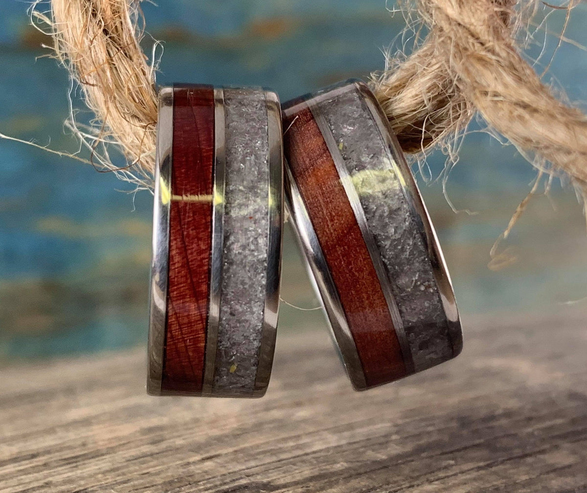 RobandLean's titanium wedding band set featuring redwood wood inlays and rose quartz accents, showcasing elegant craftsmanship.