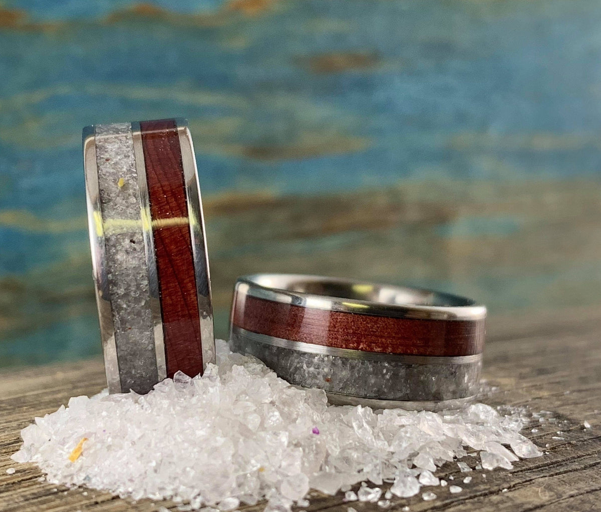 Titanium wedding band set by RobandLean's rings featuring redwood and rose quartz accents, showcasing elegant, handcrafted design.